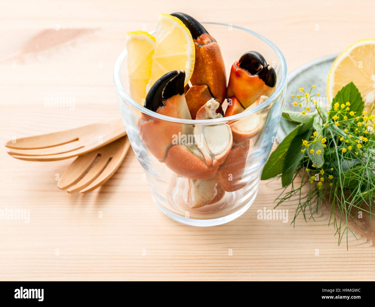 Fresh steamed red crabs leg in glass bowl . Red crabs leg with i Stock Photo