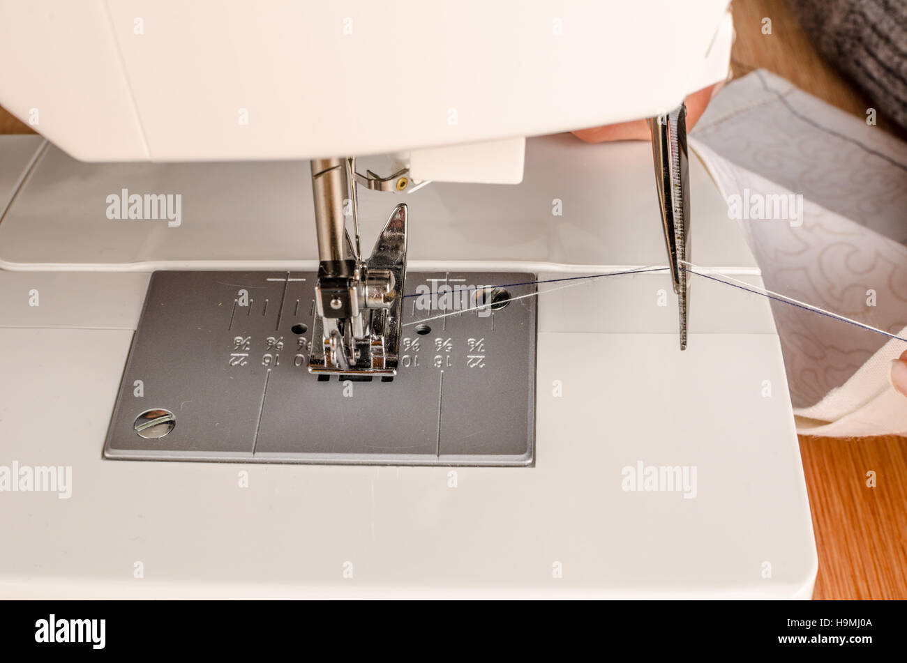 Female hands working on a domestic sewing machine Stock Photo Alamy