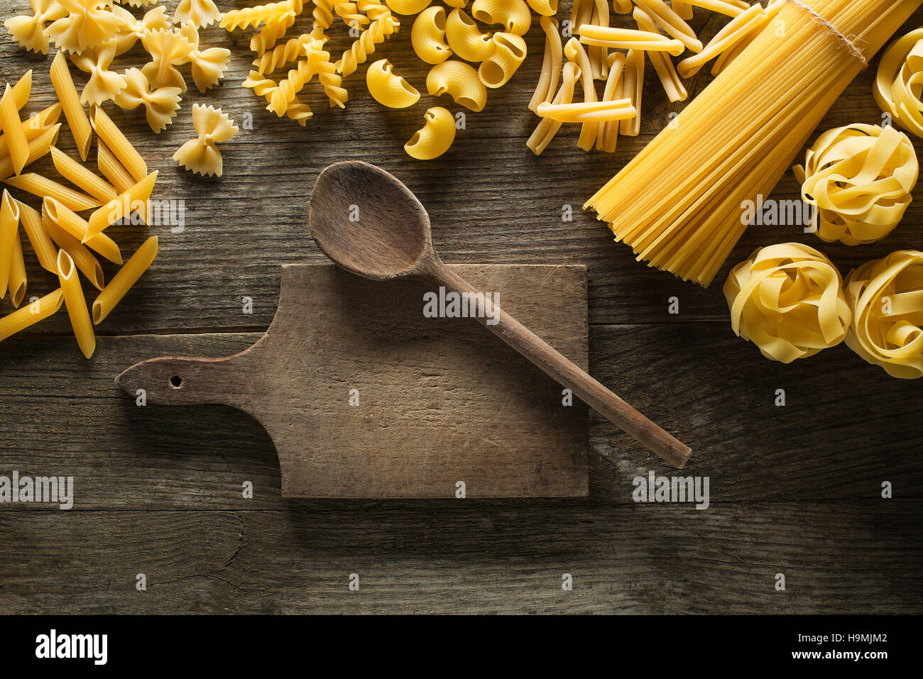 Pasta collection on rustic wooden background Stock Photo - Alamy