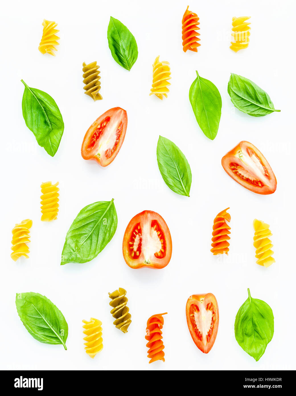 Italian food concept Fusilli with tomato and sweet basil isolate Stock Photo