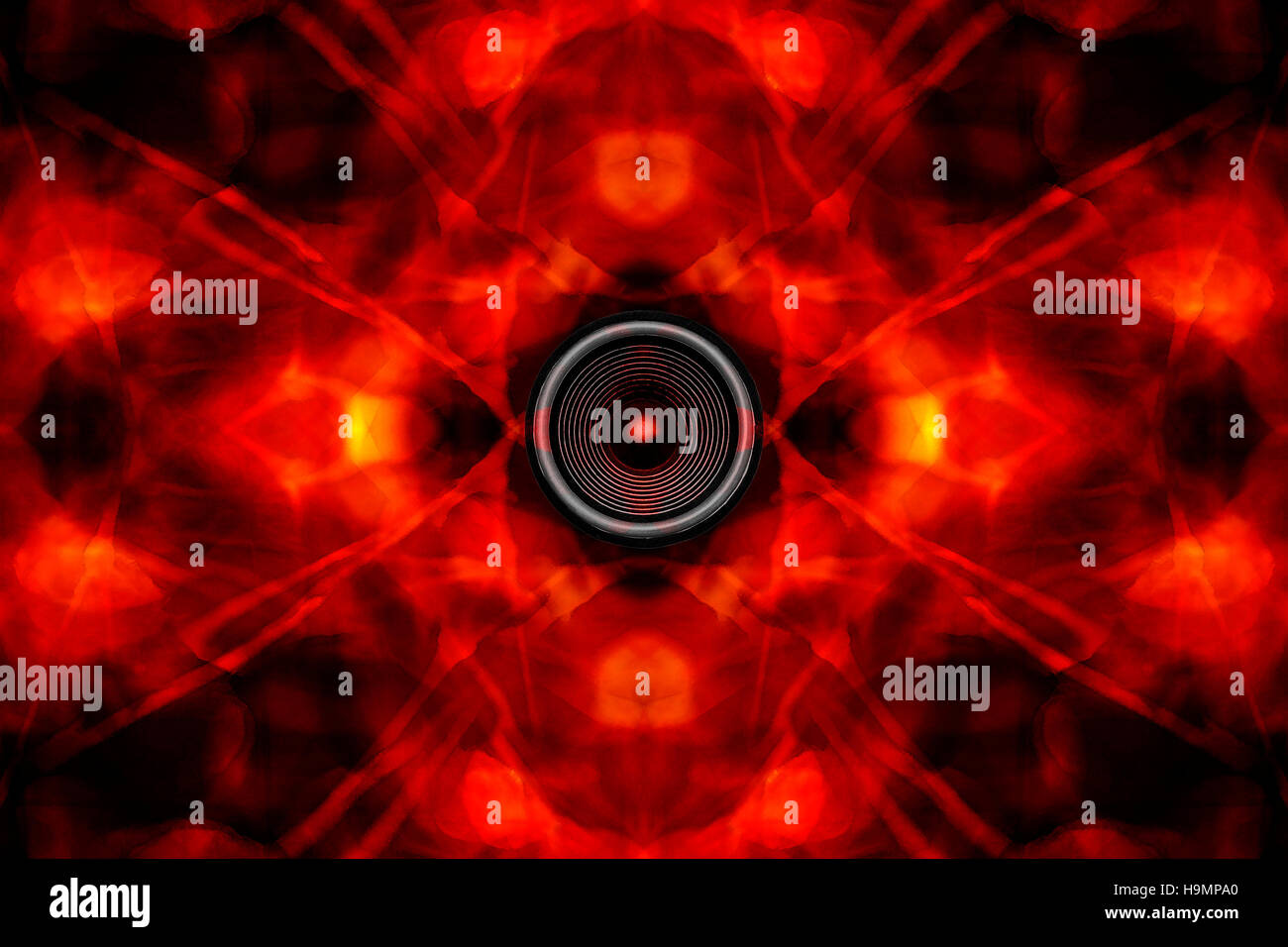 Music speaker on a groovy red kaleidoscope background Stock Photo