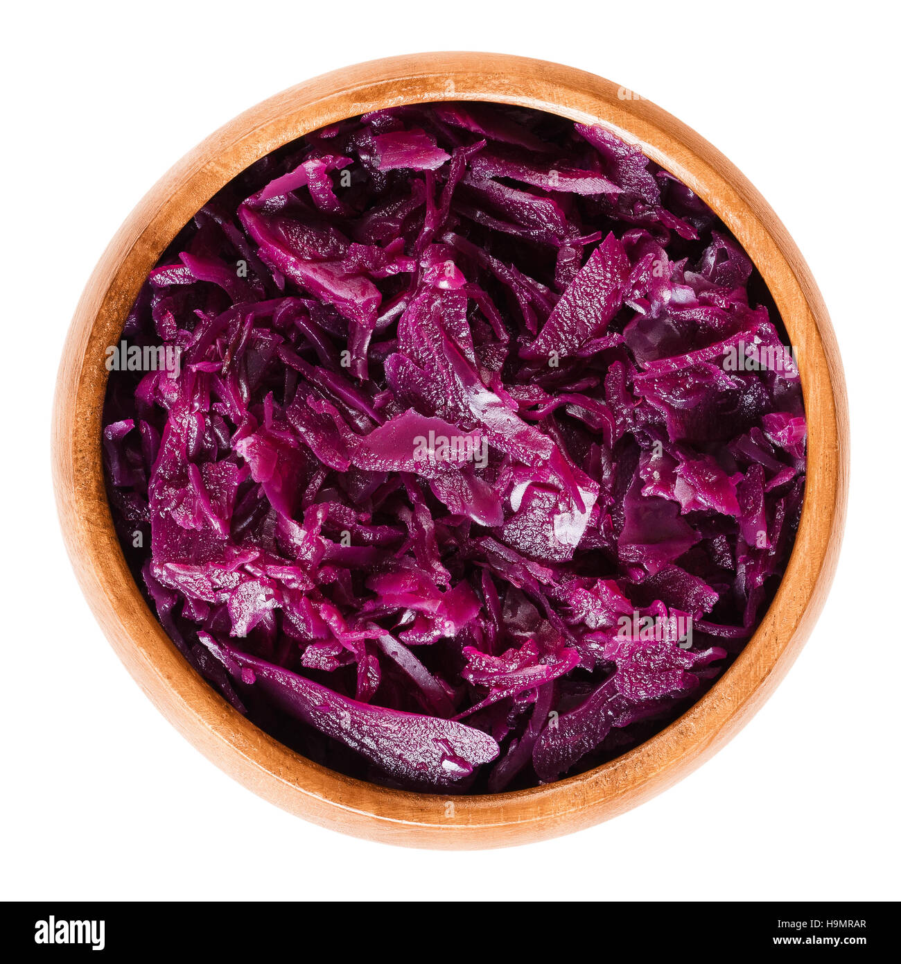 Cooked red cabbage in wooden bowl. Brassica oleracea, also purple cabbage, red or blue kraut. Stock Photo