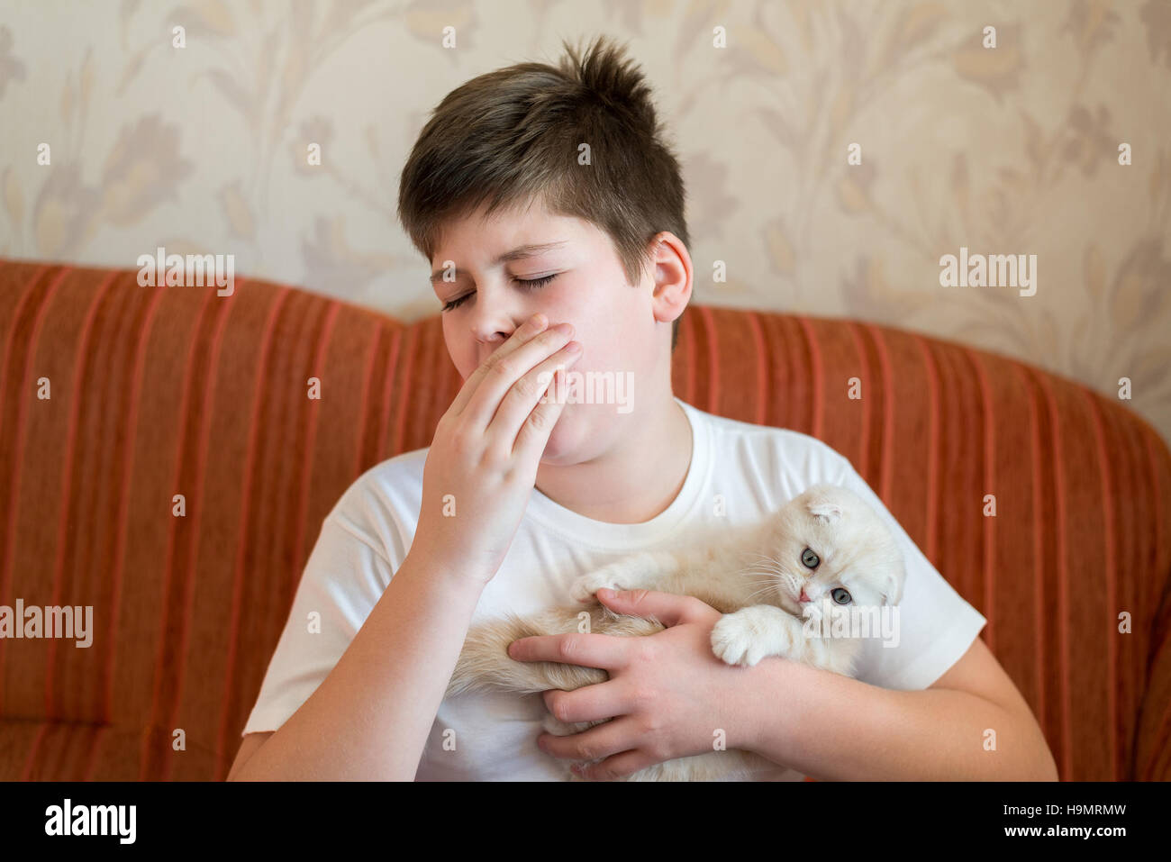 The boy is allergic to cat Stock Photo Alamy