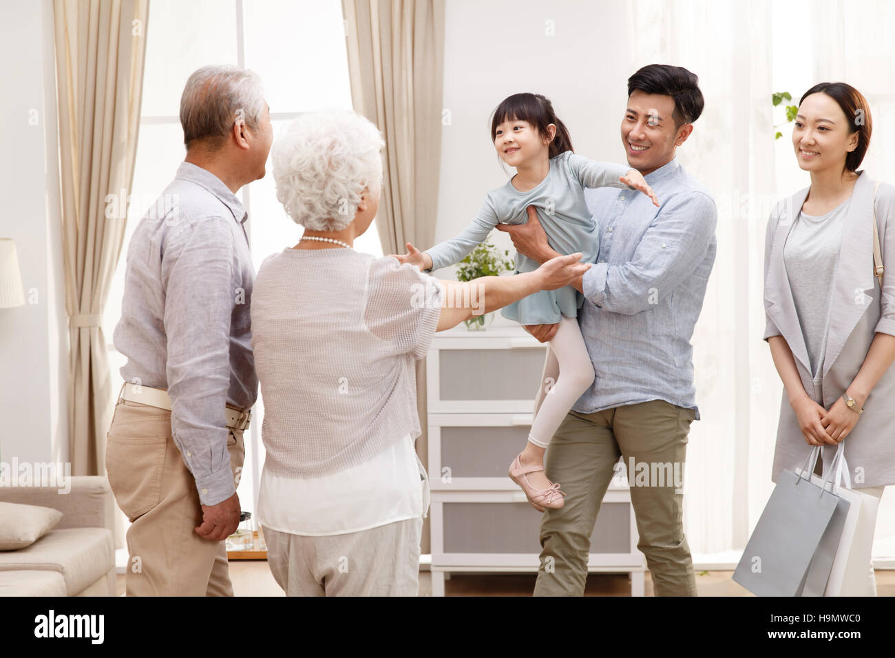 A family of three to go home to visit relatives Stock Photo Alamy