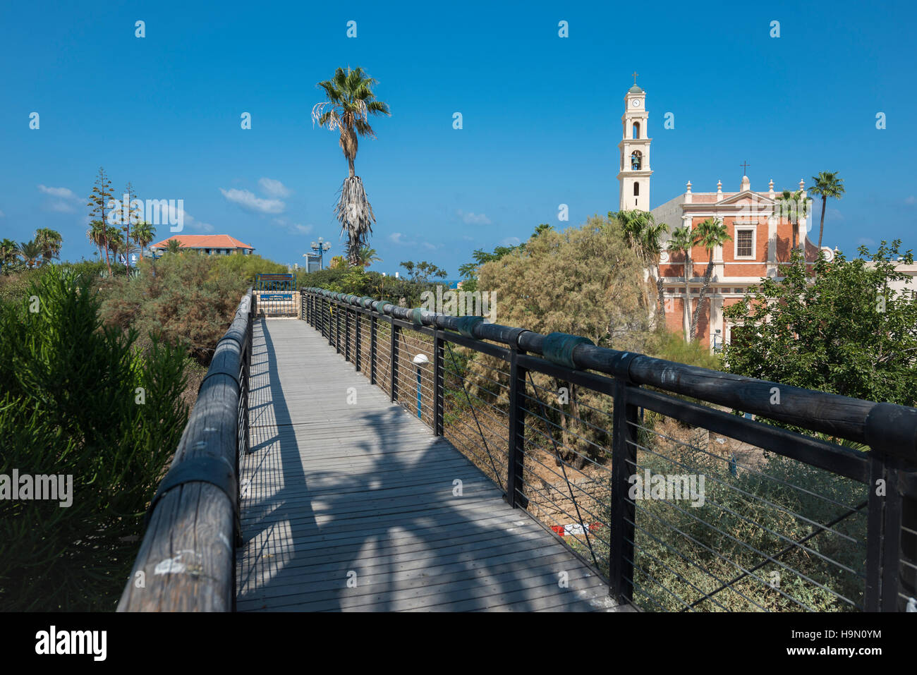 The famous wishing bridge in Jaffa with St. Peter's Church seen in the background. Israel Stock Photo