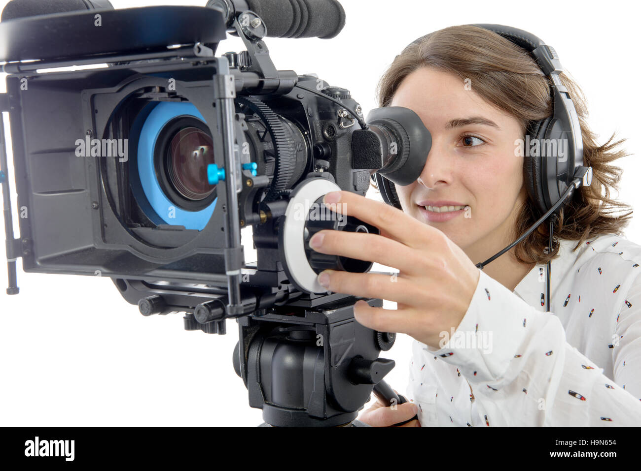 beautiful young woman with DSLR video camera and headphones Stock Photo ...