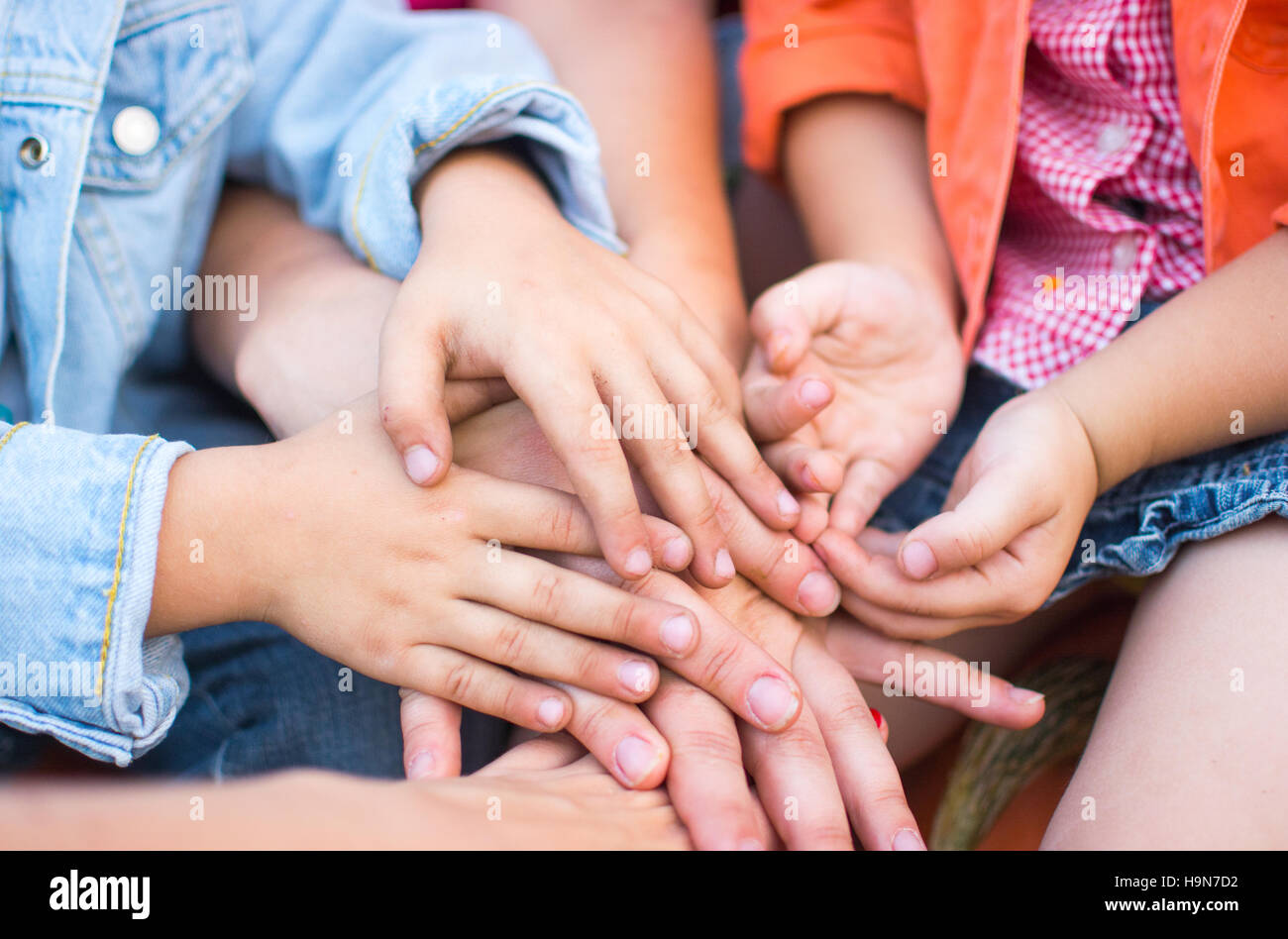 Family holding their hands together Stock Photo Alamy