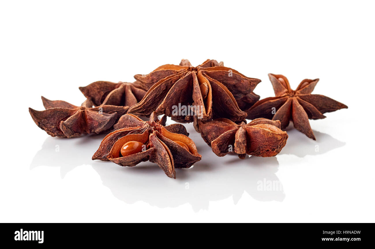 Heap of star anise fruits and seeds isolated on white background Stock