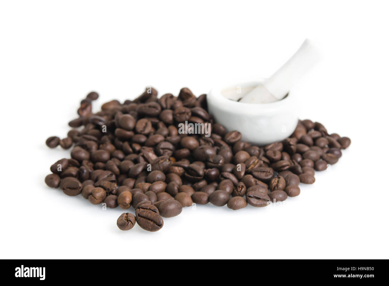 Heap of roasted coffee beans isolated on white Stock Photo - Alamy