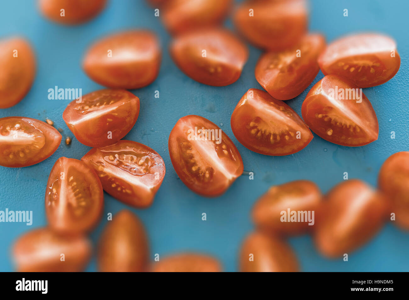 Cherry Tomatoes on Cutting Board Close Up Stock Photo - Alamy