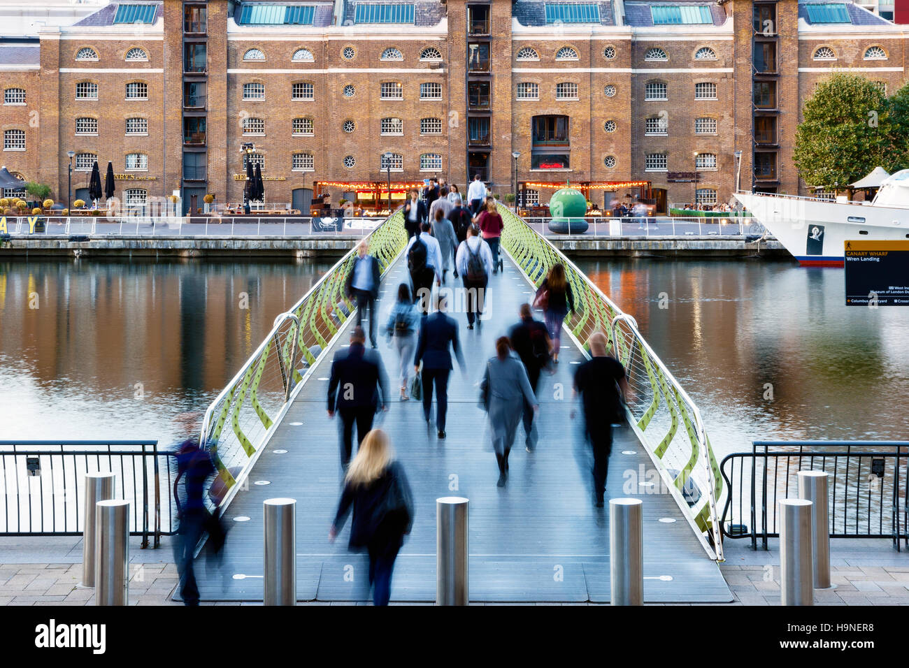 London, UK - September 21, 2016 - People crossing the North Dock Footbridge from Canary Wharf to West India Quay Stock Photo