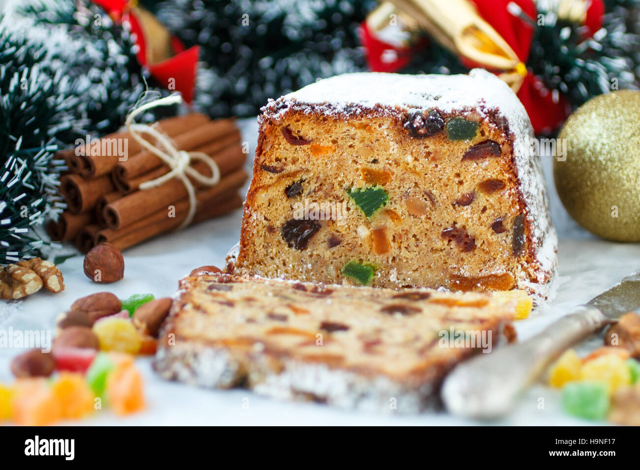 Traditional Christmas cake with nuts, candied fruit, raisins and fruits