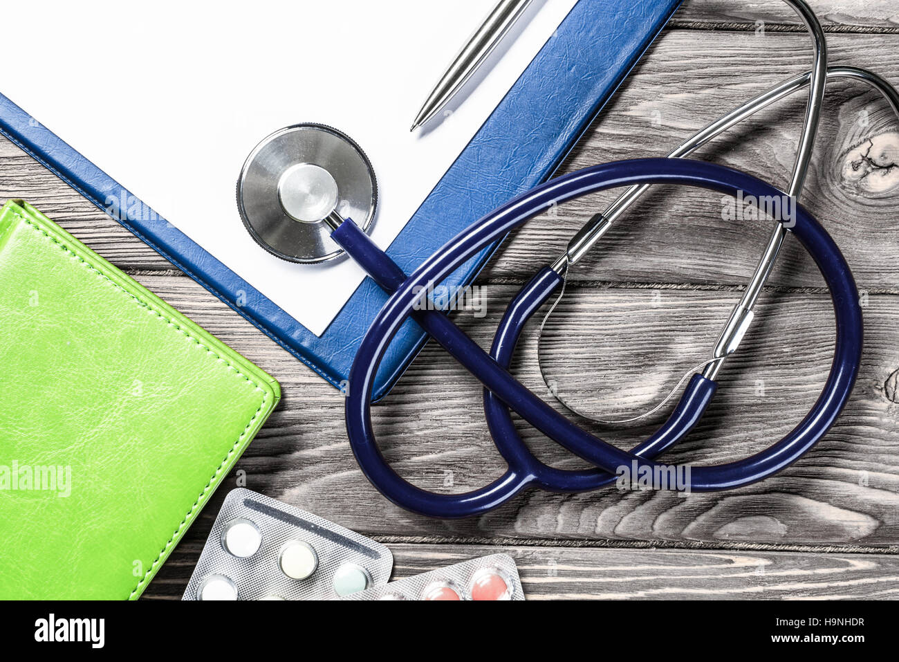 Desk of doctor with medicine things Stock Photo - Alamy