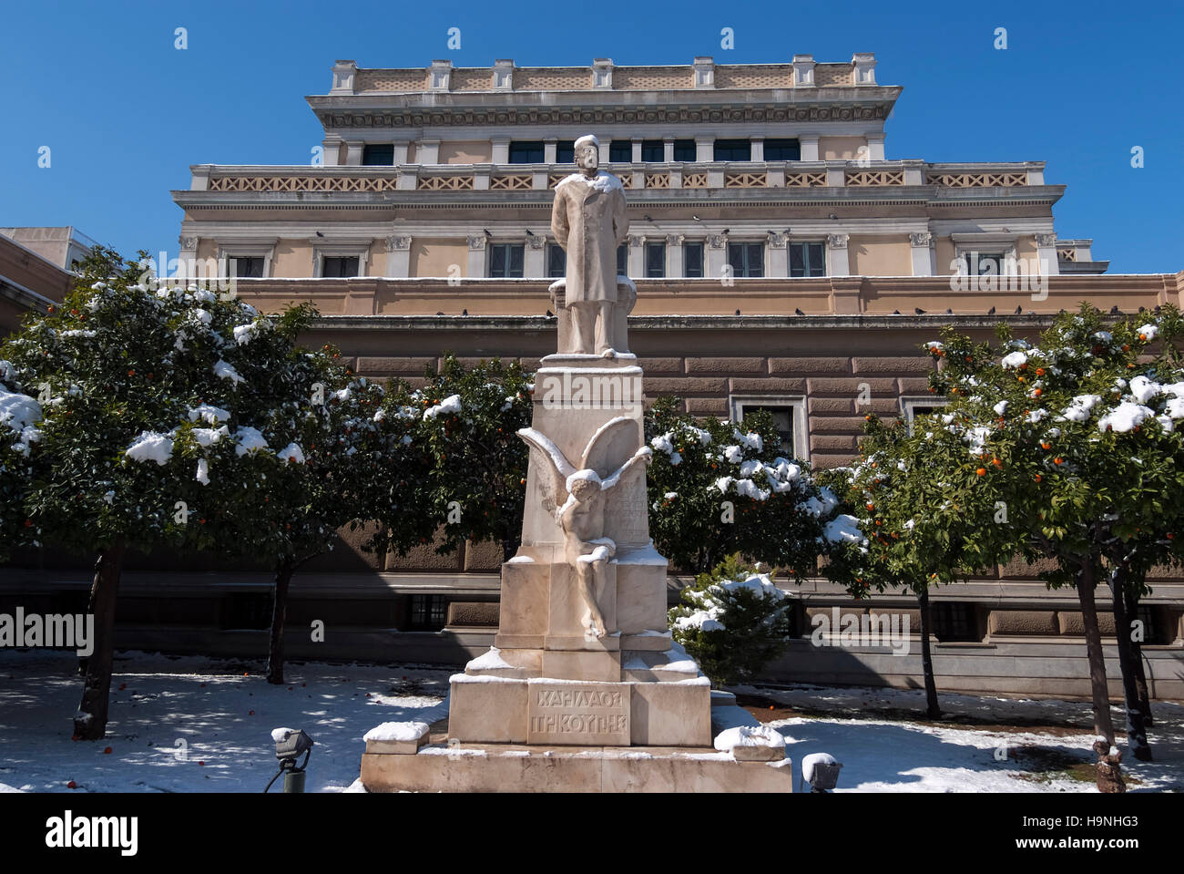 Charilaos Trikoupis statue with snow in the old Parliament of Athens