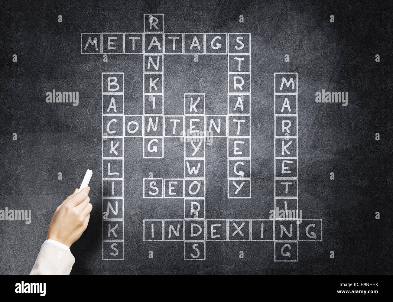 Woman draw crossword Stock Photo Alamy