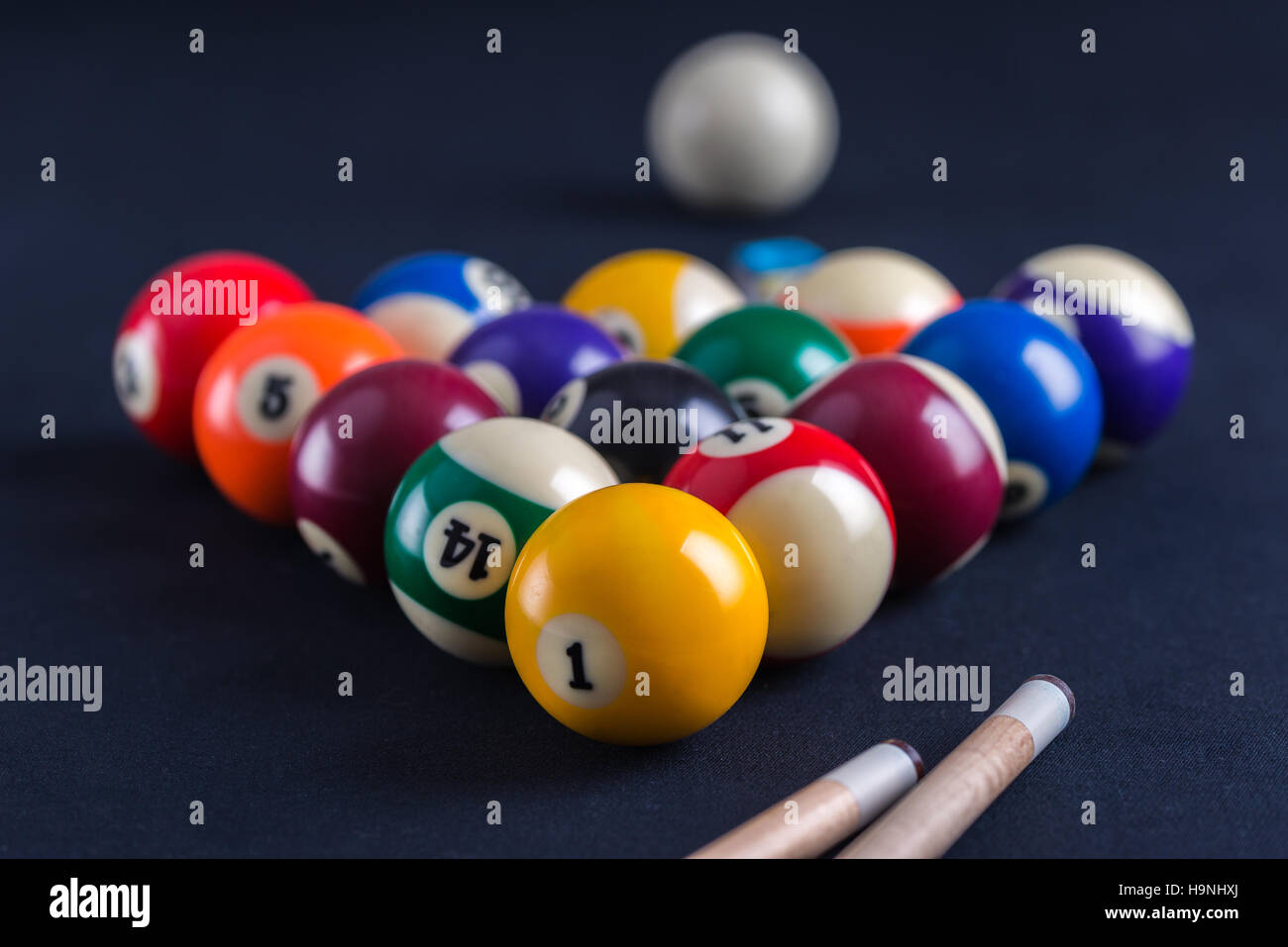 Blue billiard table with all balls and cues. Stock Photo