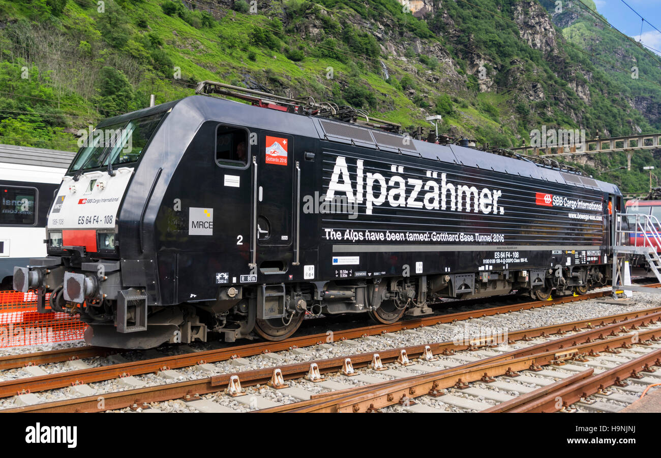 Siemens ES64F4 electric locomotive operated by SBB Cargo in special livery, celebrating the opening of Gotthard Base Tunnel. Stock Photo