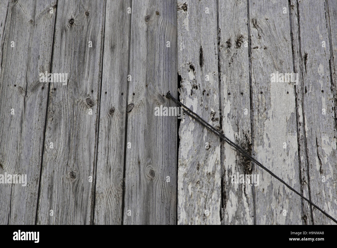 Scraped wooden door in urban building, construction Stock Photo Alamy