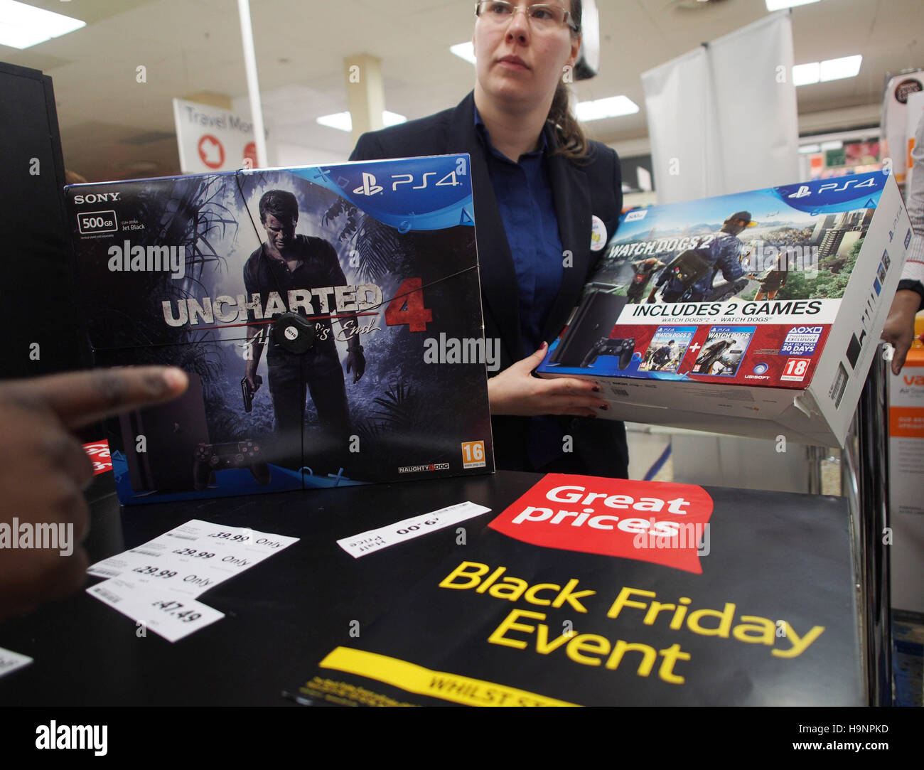 A customer is shown Sony PS4 video game consoles on Black Friday, at a Tesco  Extra store in Ponders End, Enfield, north London Stock Photo - Alamy