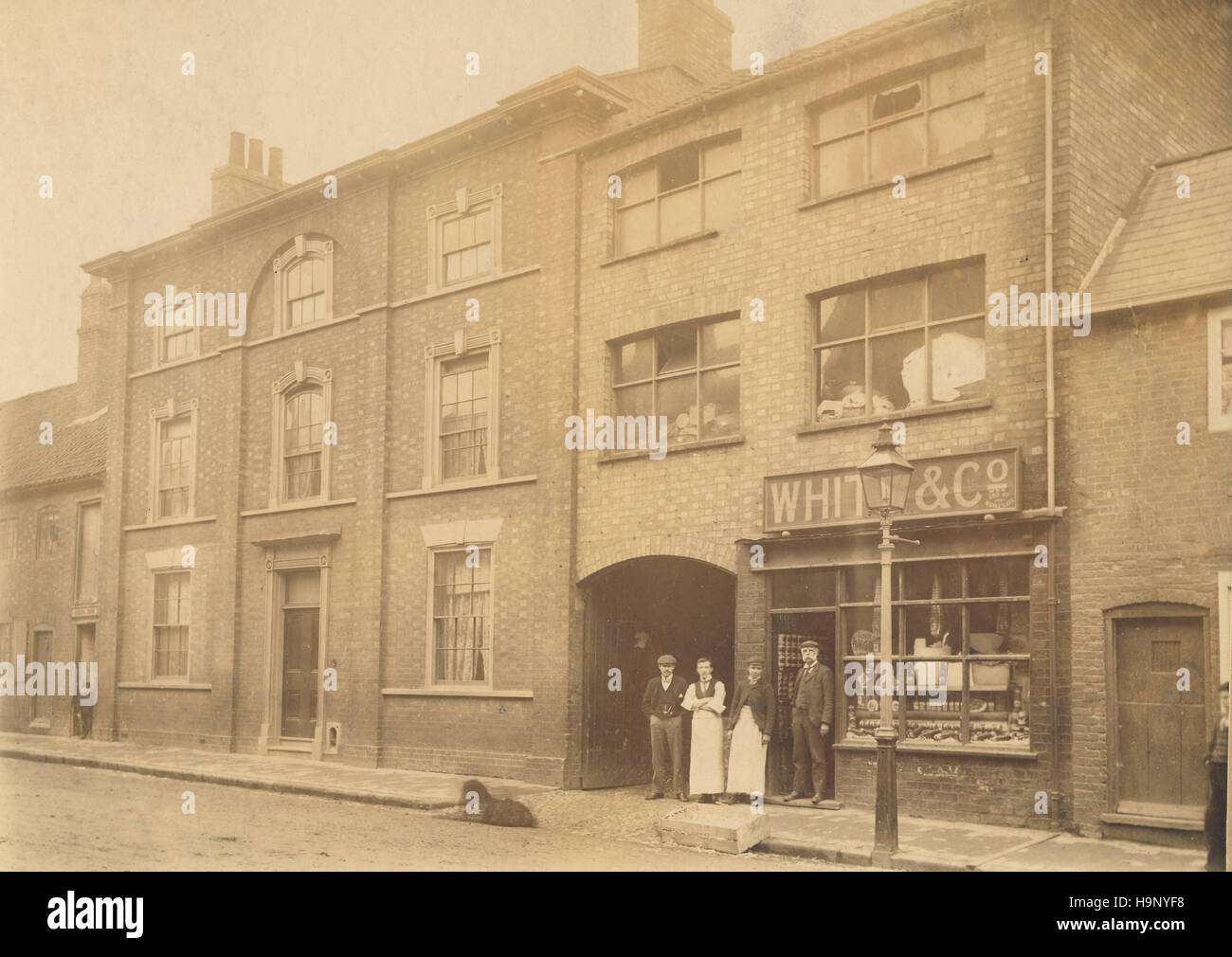 Historic archive image of men outside a shop in Portland Street, Newark on Trent, Nottinghamshire. c1900s. Stock Photo