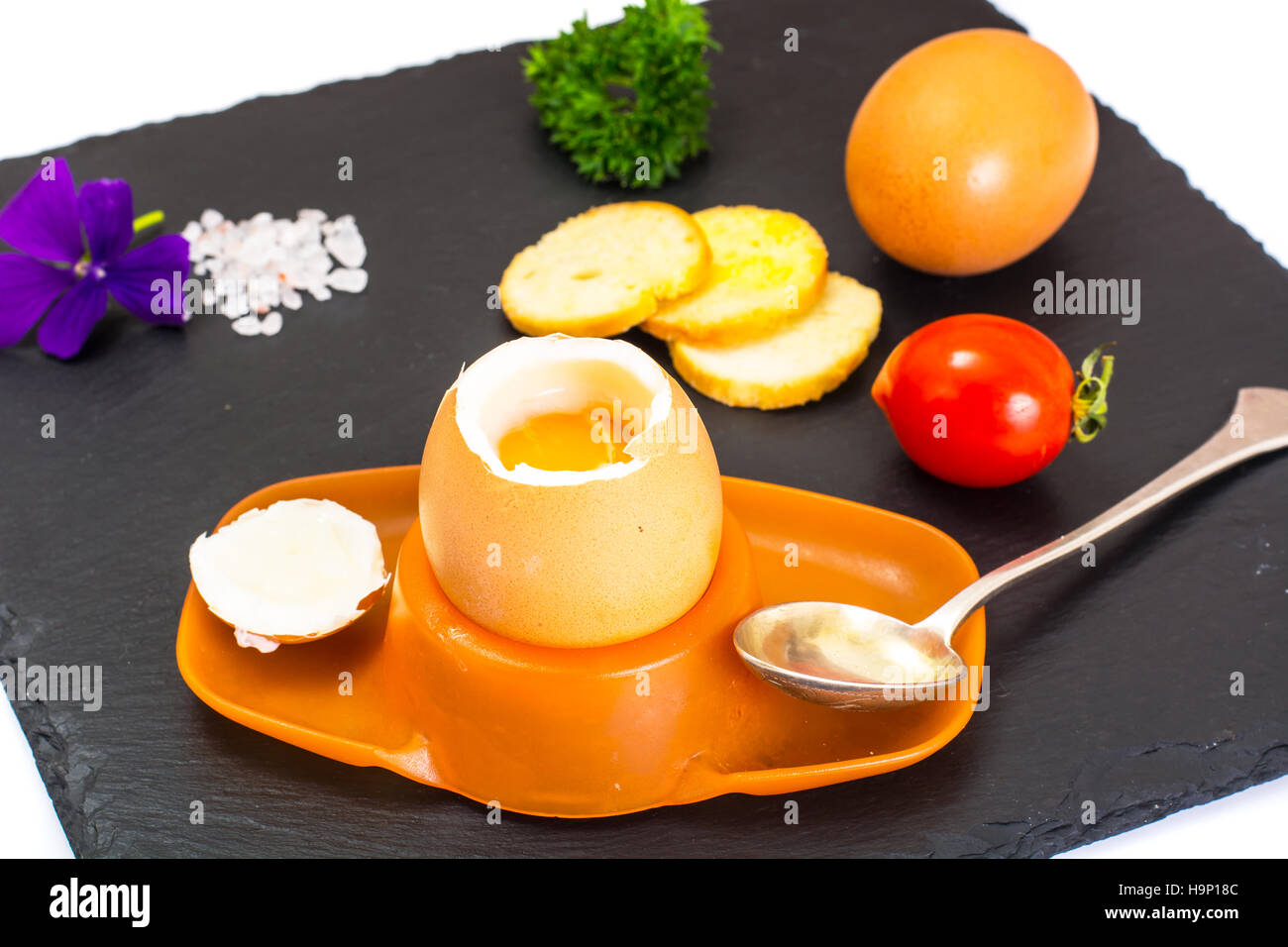 Egg Cooked Soft Boiled on Black Stone Plate Studio Photo Stock Photo