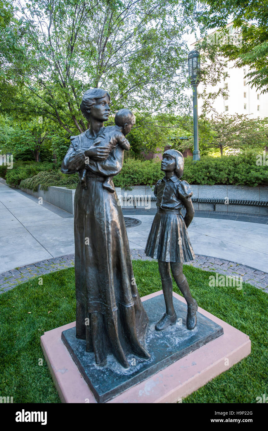 Statue of Mormon mother with baby and daughter in Daughters of Utah