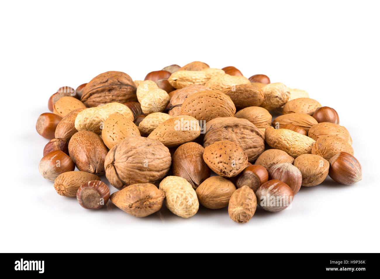 Mixed nuts in shells on a white background Stock Photo Alamy