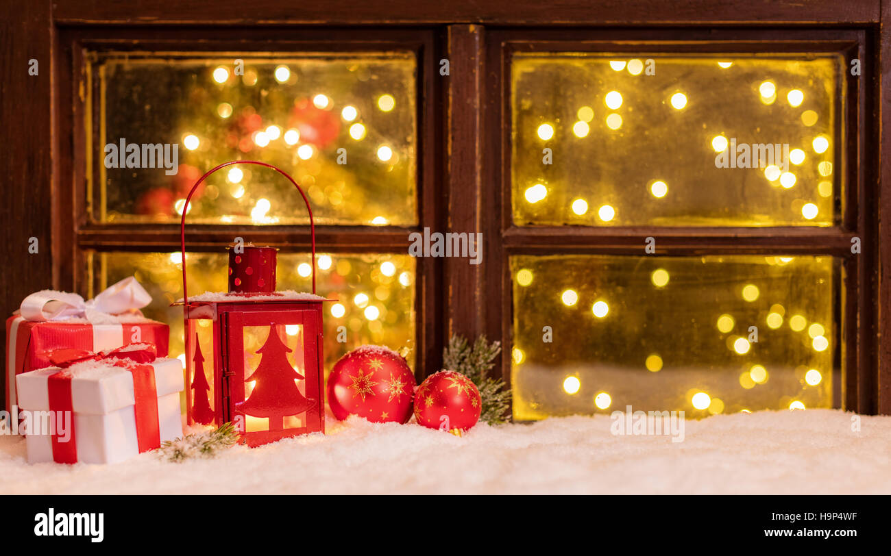 Atmospheric Christmas window sill with decoration and blur tree wth ...