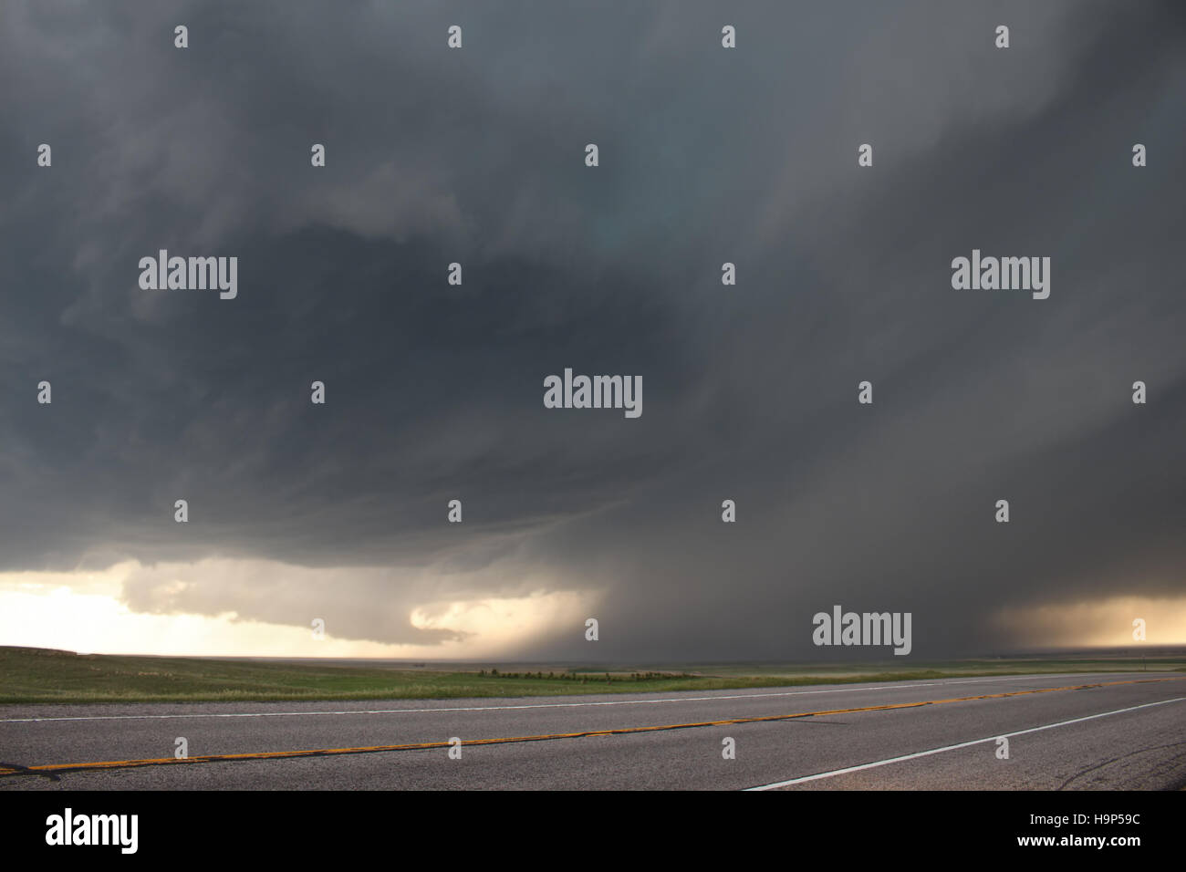 An intense supercell thunderstorm glides over the high plains of eastern Colorado in the springtime. Stock Photo