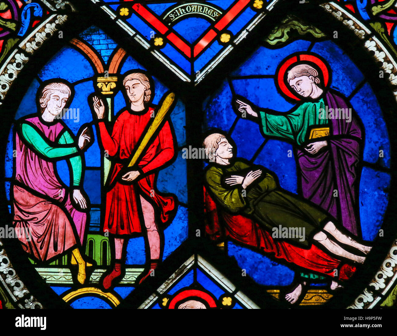 Stained Glass window in the Cathedral of Caen, Normandy, France, depicting scenes in the Life of Saint John the Evangelist Stock Photo