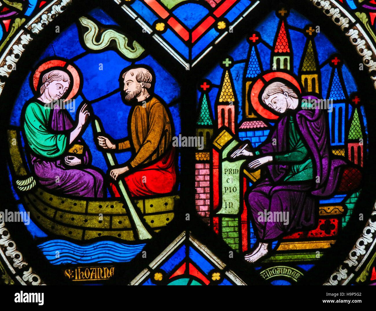 Stained Glass window in the Cathedral of Caen, Normandy, France, depicting Saint John the Evangelist on a boat and on Patmos Stock Photo