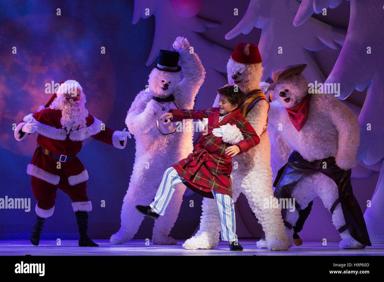 London, UK. 23 November 2016. Federico Casadei as Father Christmas and Cameron Sutherland as Boy. The Snowman returns to The Peacock theatre for the Christmas season and runs from 23 November 2016 to 1 January 2017. Based on the book by Raymond Briggs and the film directed by Dianne Jackson, the show tells the story of a young boy's adventures when his snowman comes to life on Christmas Eve. With Martin Fenton as Snowman and Cameron Sutherland as Boy. Stock Photo