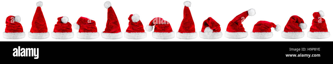 wide panorama row of red white plush santa claus christmas xmas hat isolated background Stock Photo