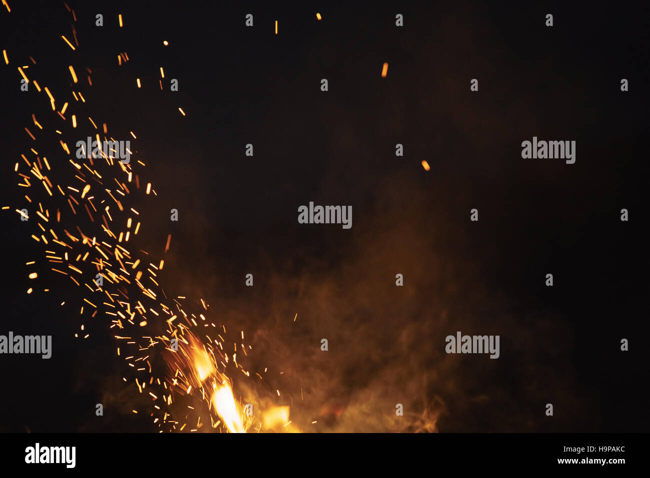 bonfire spark in the dark sky in night Stock Photo - Alamy