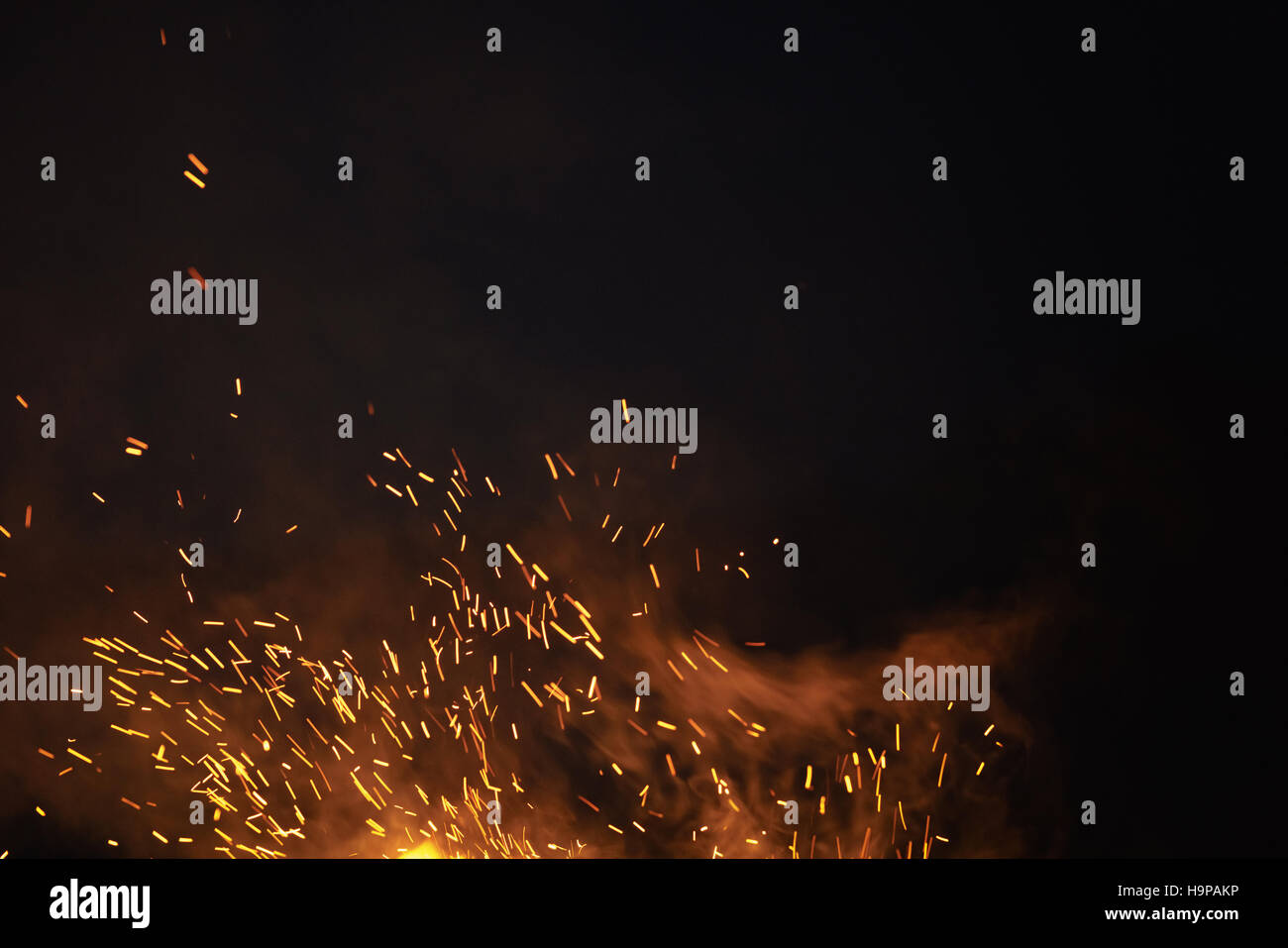 bonfire spark in the dark sky in night Stock Photo - Alamy