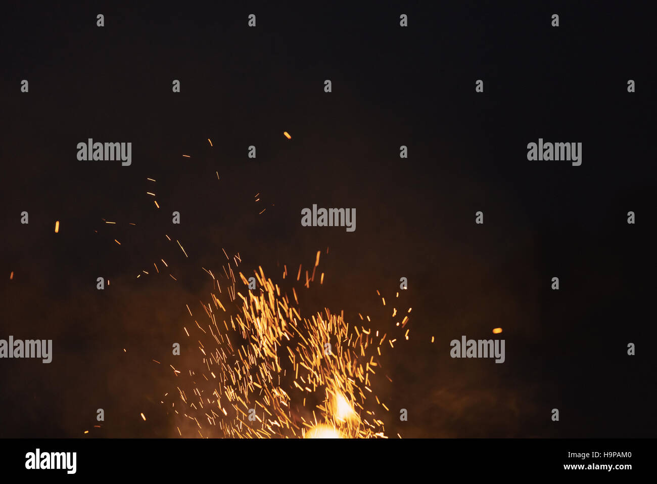 bonfire spark in the dark sky in night Stock Photo - Alamy