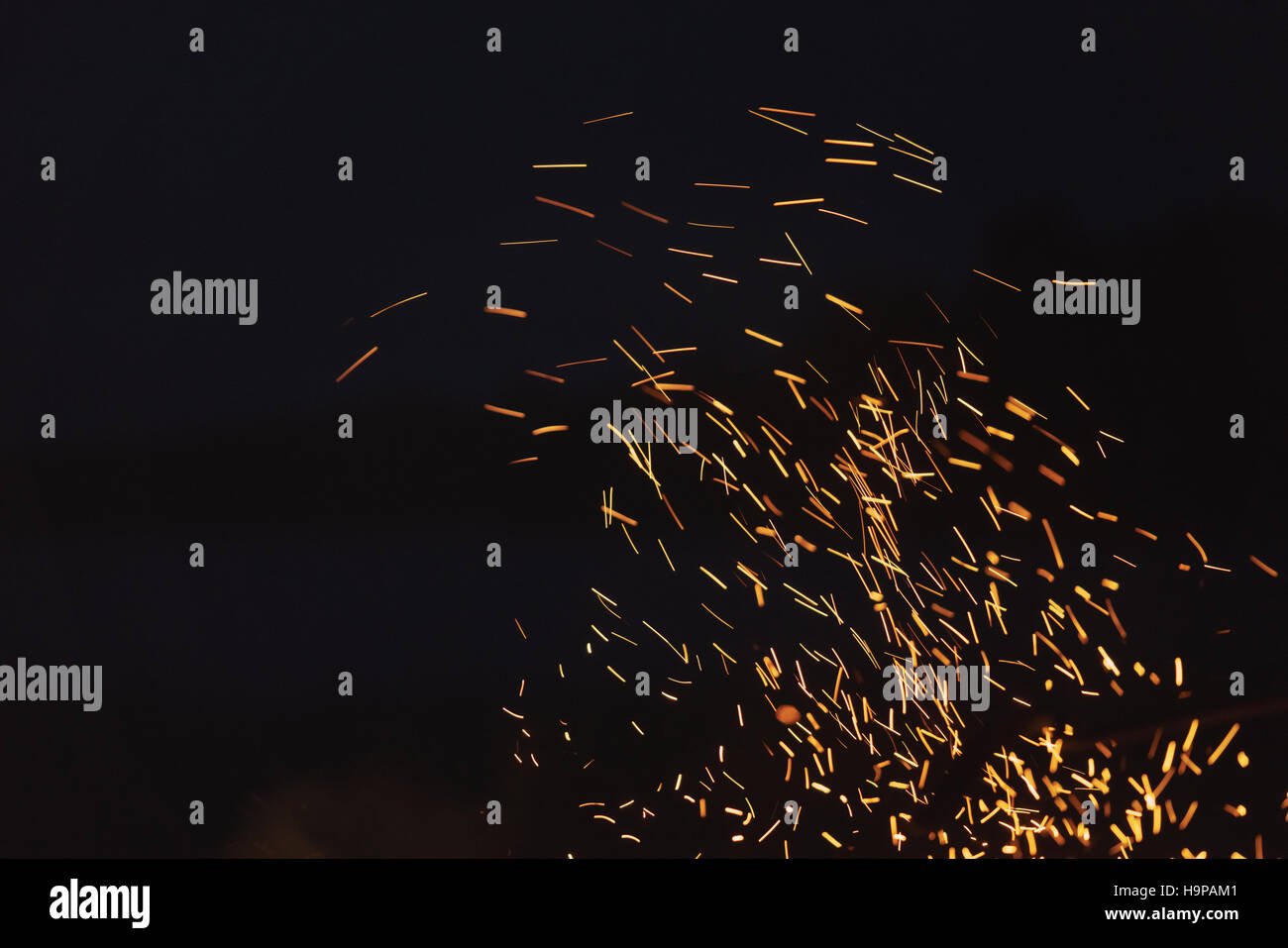bonfire spark in the dark sky in night Stock Photo - Alamy