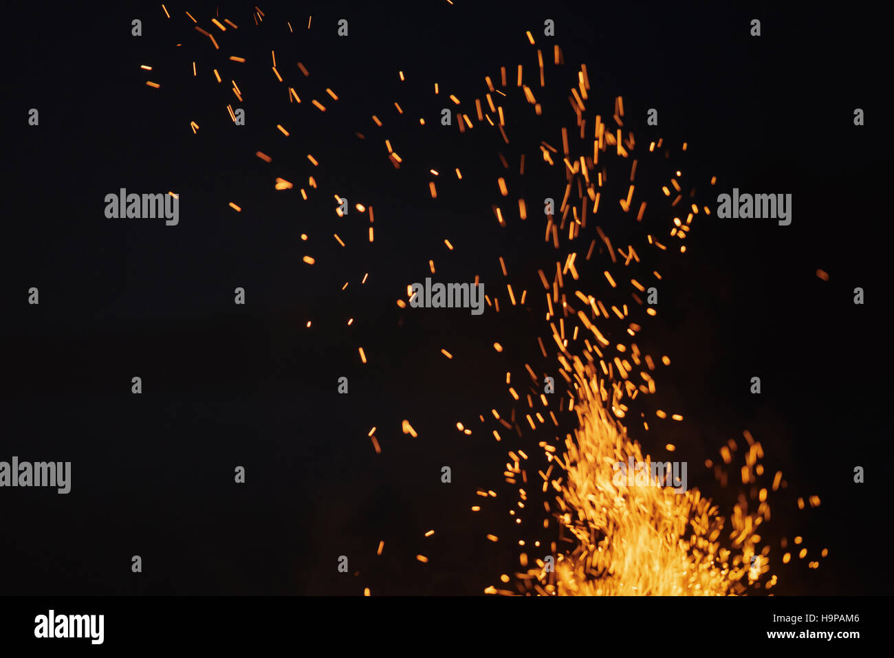 bonfire spark in the dark sky in night Stock Photo - Alamy