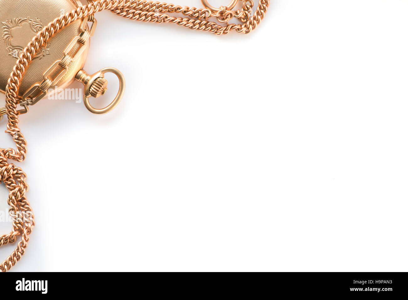 Ancient golden watch and chains composed as the frame. White background