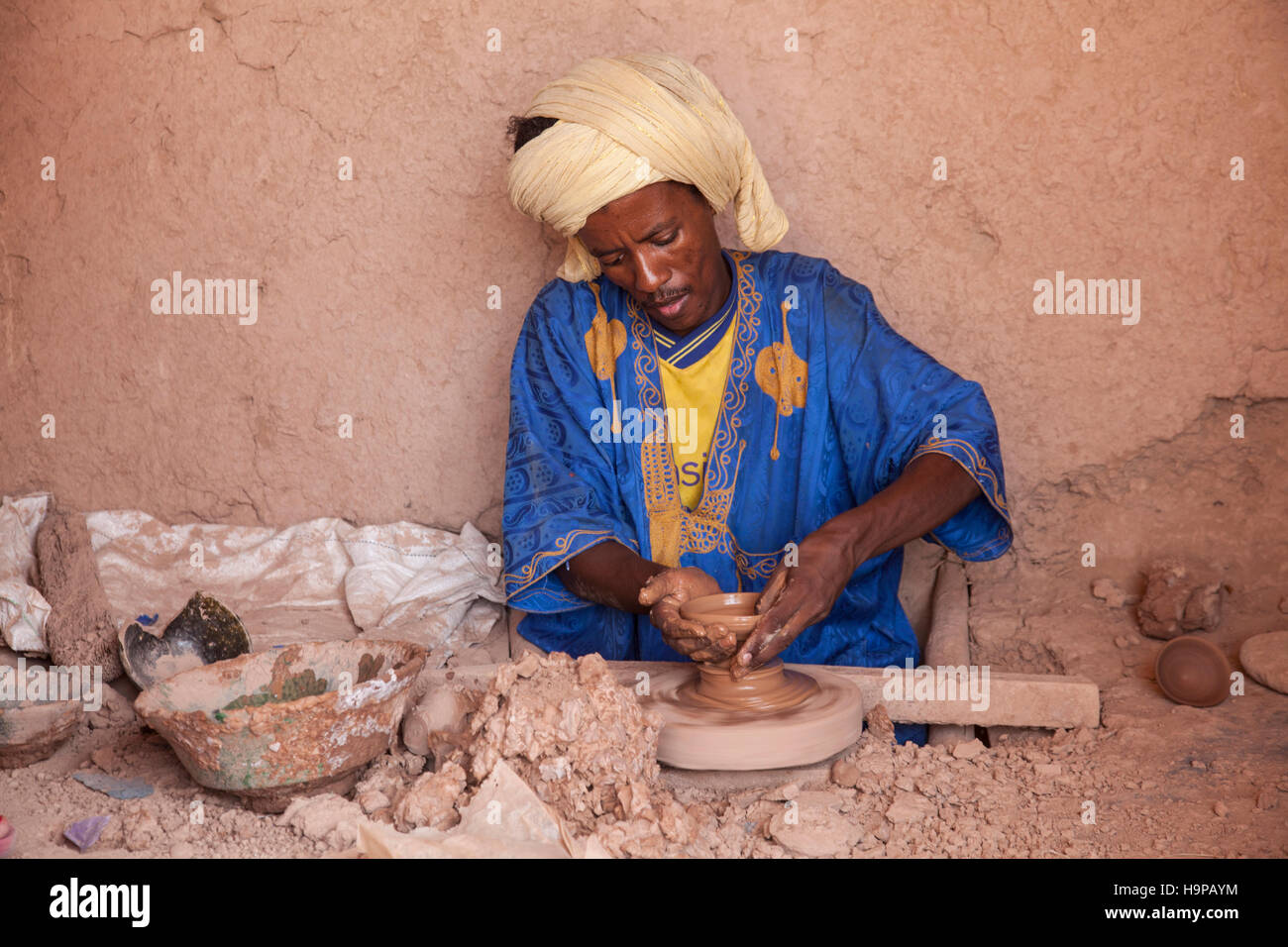 Arabian potter with spinning pottery wheel in Tamegroute. Stock Photo