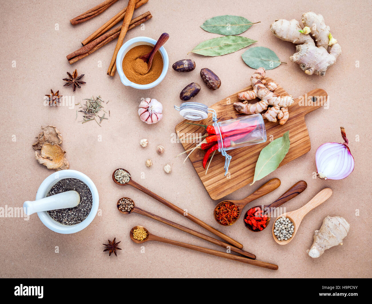 Mixed spices and herbs background cinnamon stick and cinnamon po Stock Photo