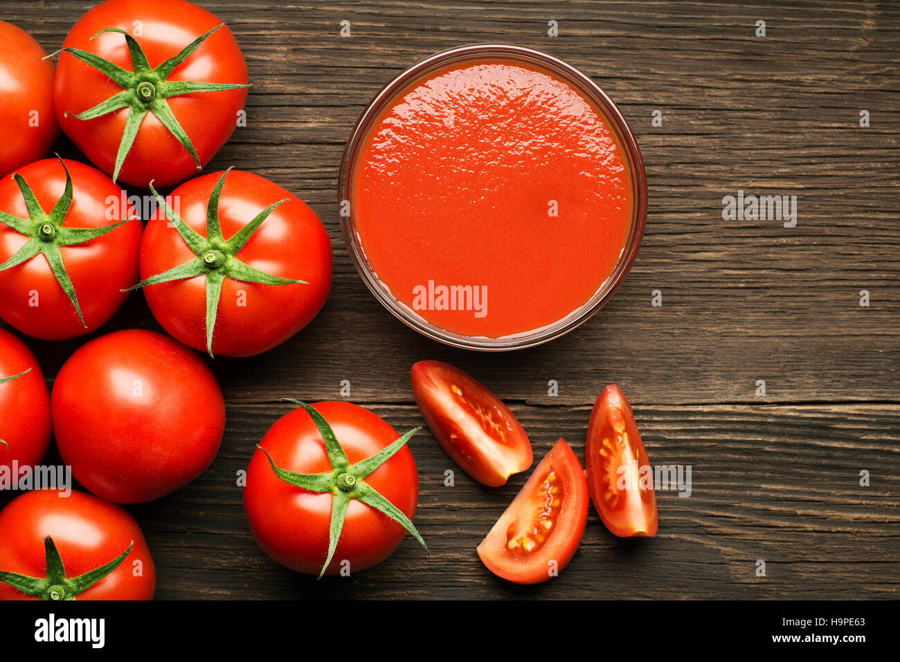Fresh cherry tomato sauce on rustic wooden background Stock Photo