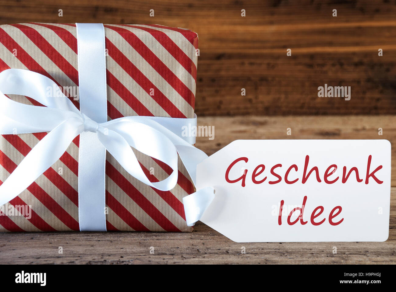 Present With Label, Geschenk Idee Means Gift Idea Stock Photo