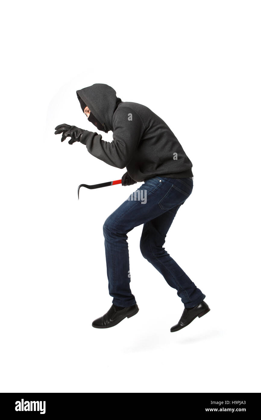 Jumping thief with master key Stock Photo