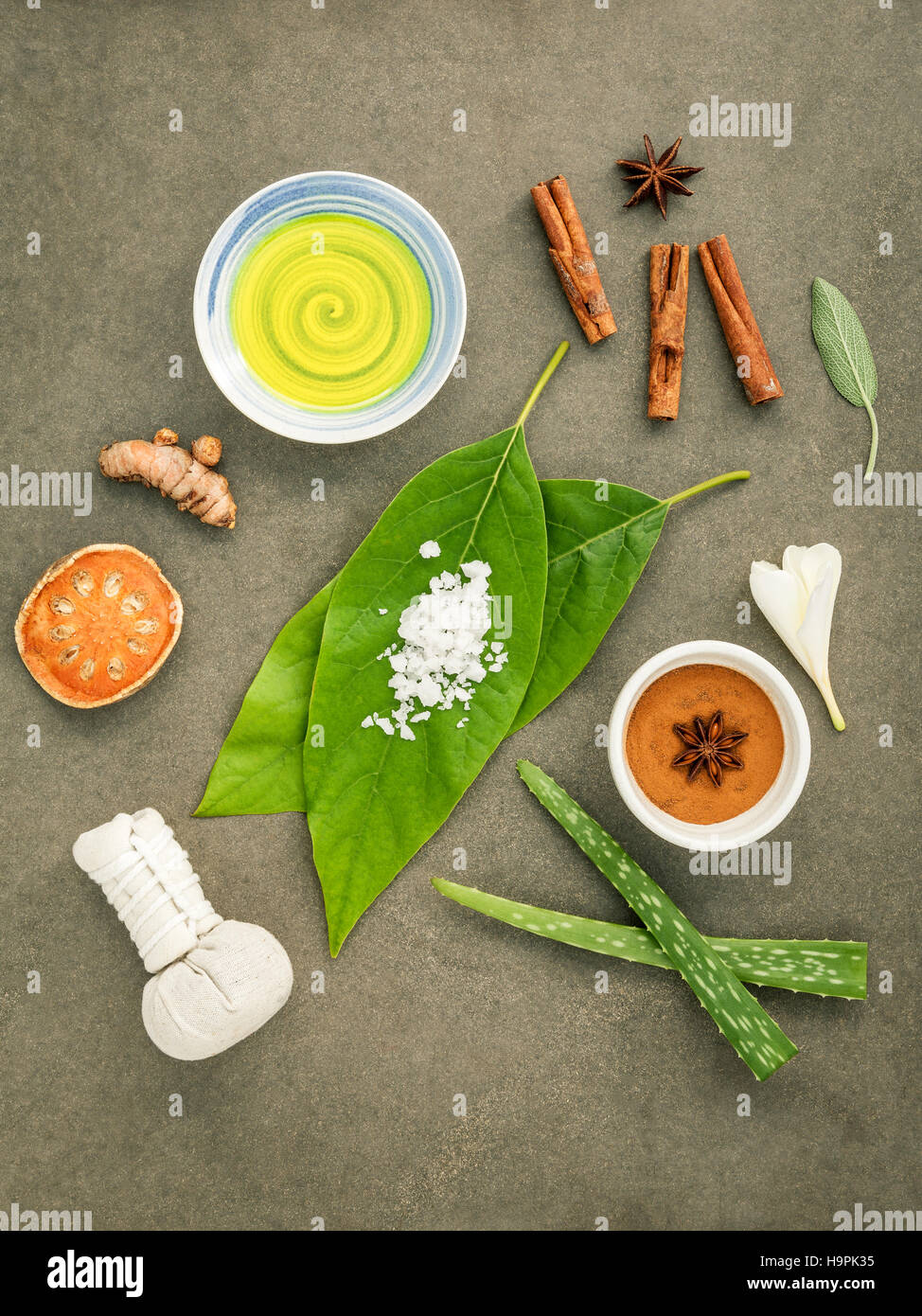 Avocados  leaves with nature spa ingredients turmeric,herbal com Stock Photo