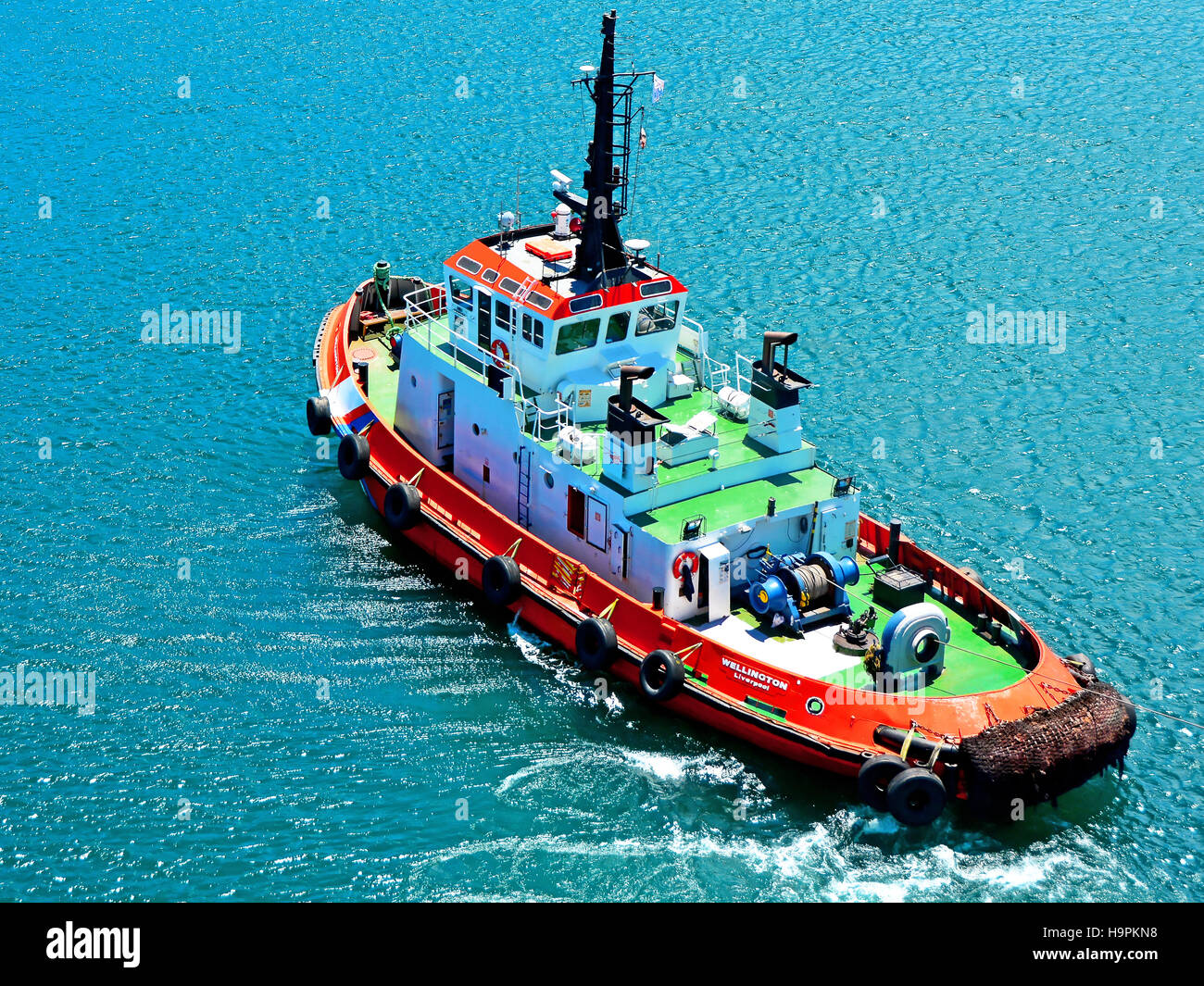 Tug boat guiding ship hires stock photography and images Alamy