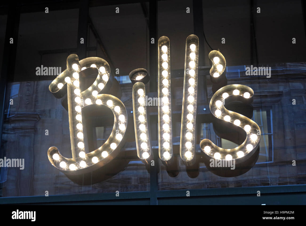 Bills in electric lights, restaurant Glasgow Queen St, Scotland, UK Stock Photo