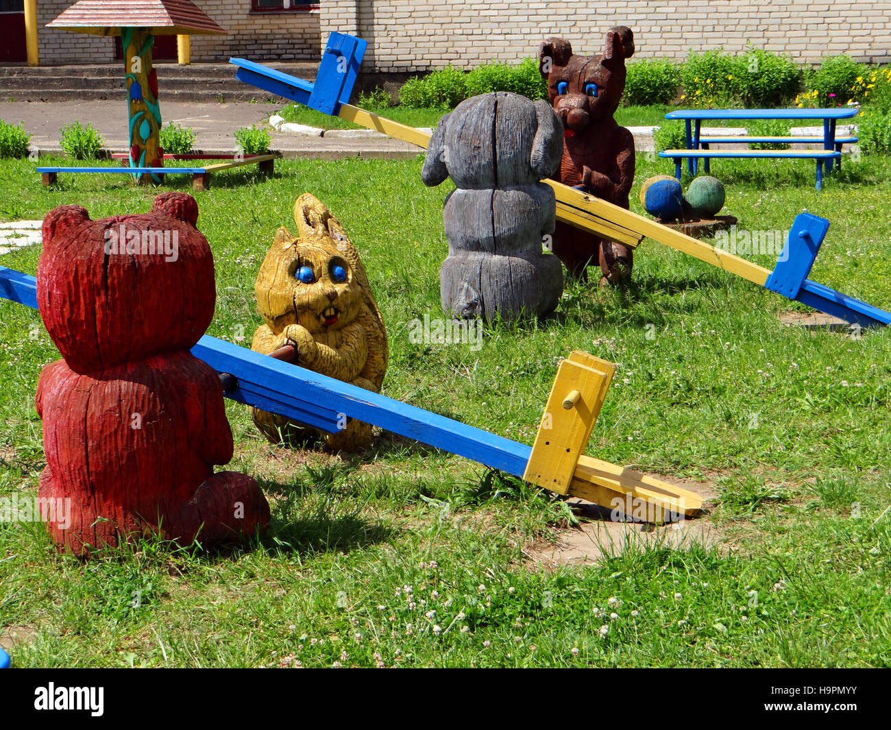 Children's playground with wooden swings Stock Photo Alamy