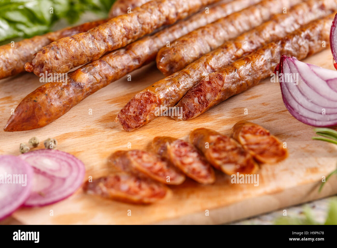 Smoked thin sausage salami Stock Photo Alamy