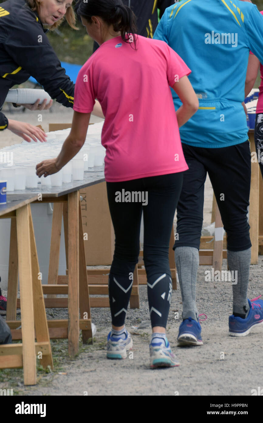 Water station in running competition. Stock Photo
